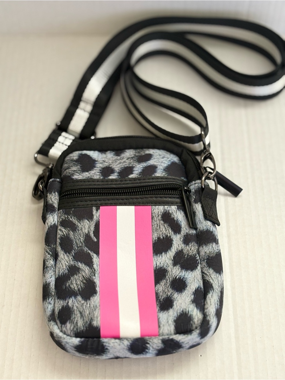 Haute Shore CASEY SHOWOFF Leopard Print Crossbody with Pink Stripe.